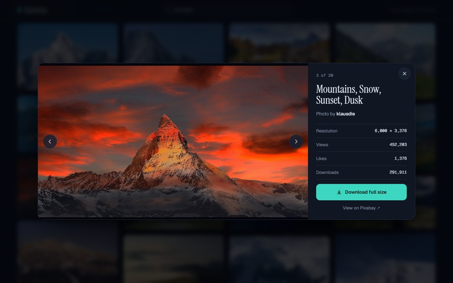 Imnexa picture viewer showing a mountain at sunset with resolution, views, likes and a Download full size button